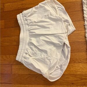 White lululemon hotty hot low rise 4in shorts. Size 4